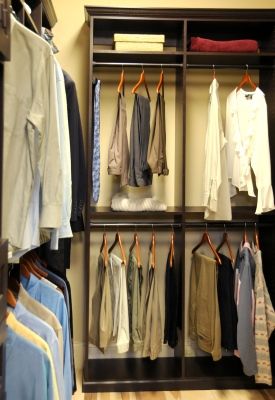 a custom made closet with many clothes