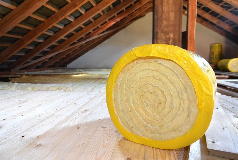 A Roll of Insulating Wool on Attic Floor