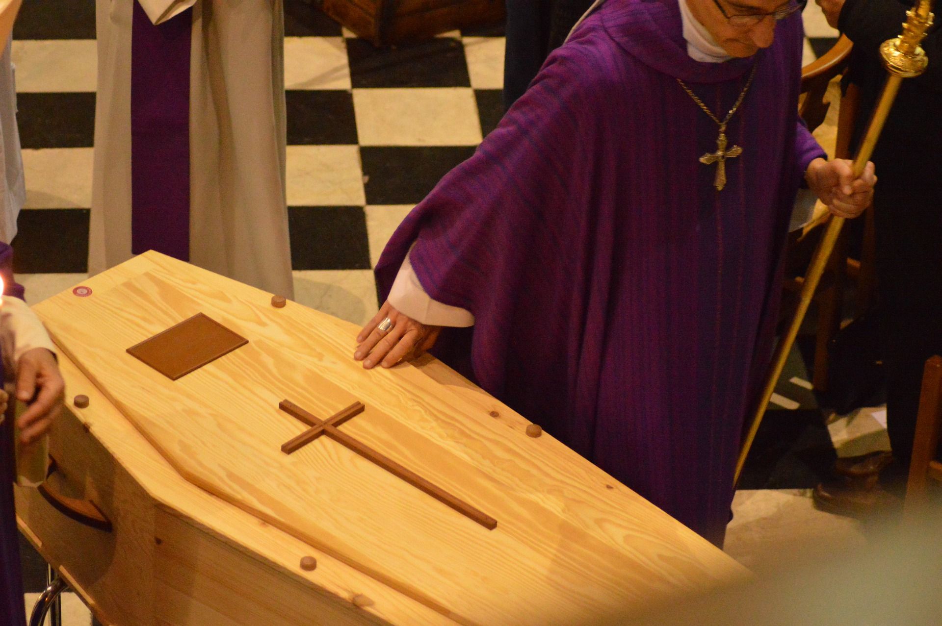 A Catholic Priest During a Funeral Service