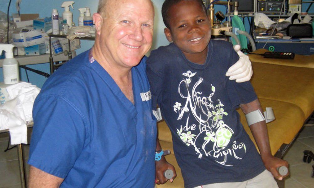 Dr. Vieth smiles with patient in Haiti
