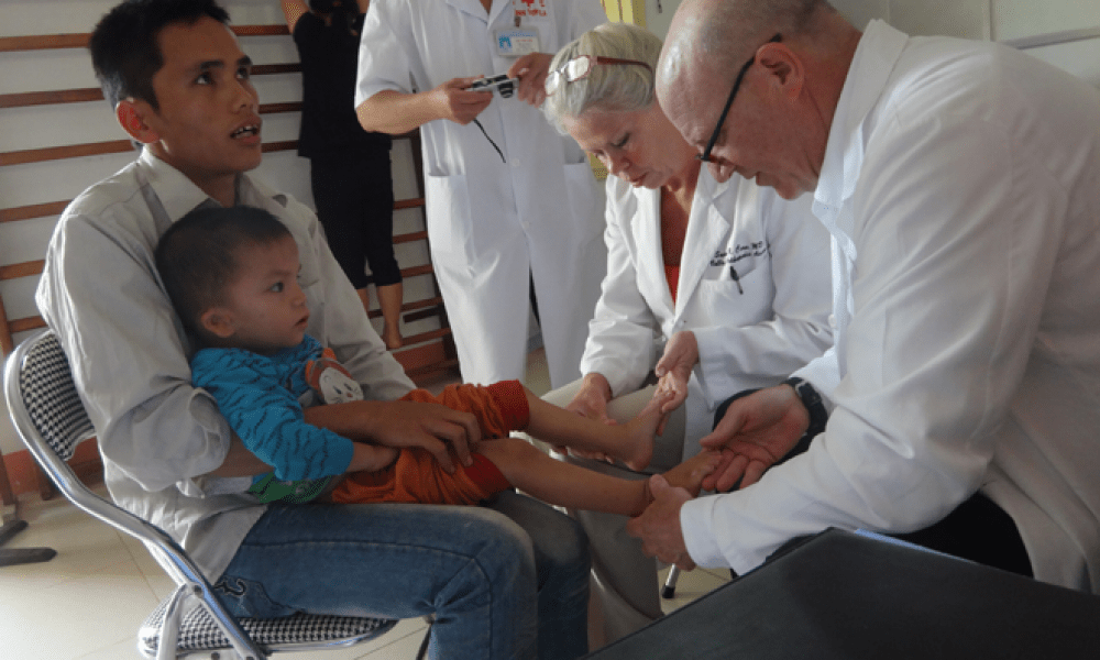 Dr. Veith checks a patient while in Vietnam