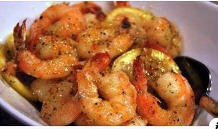 Seasoned and cooked shrimp in a bowl.