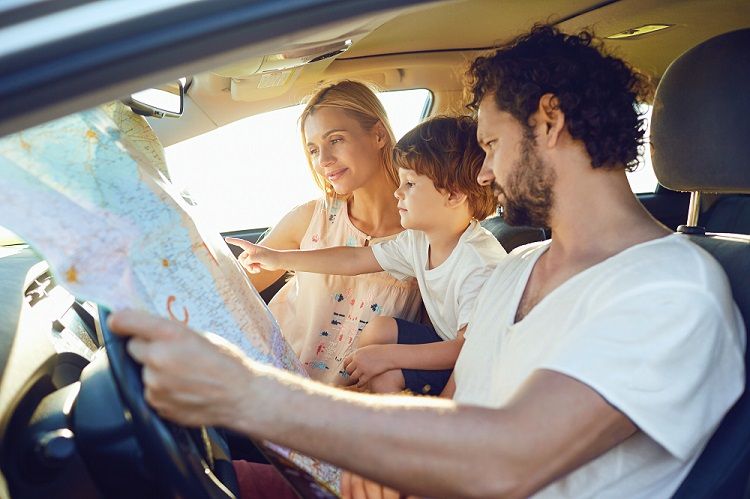 Family Looking at Map in Car for Road Trip