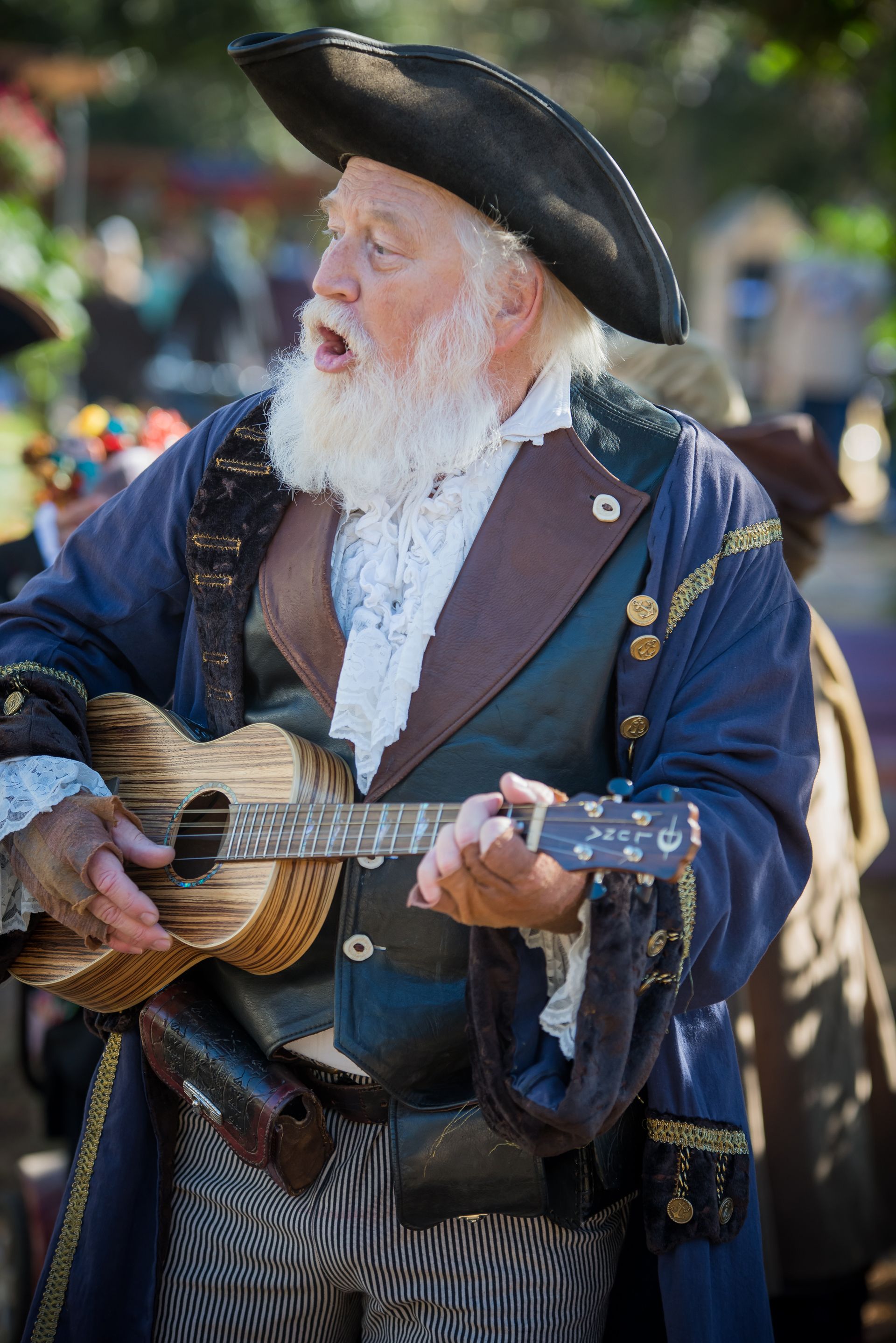 We discovered this patron entertaining fellow faire goers with a song and a really beautiful guitar.