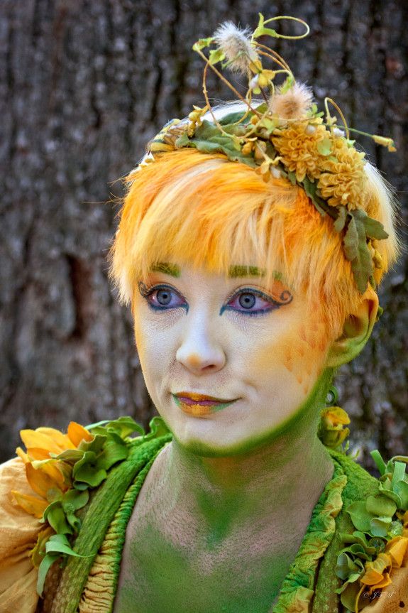 Spring Fairy's yellow and green colors camouflage her to blend with the spring flowers and grasses.