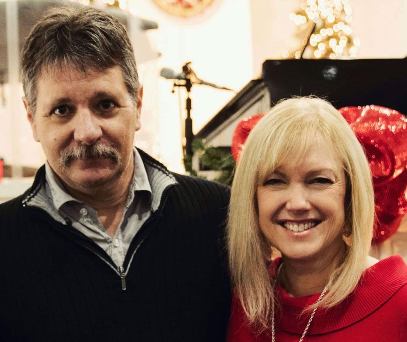 Berry alumna Susan Powell and her husband smile for a close-up photo