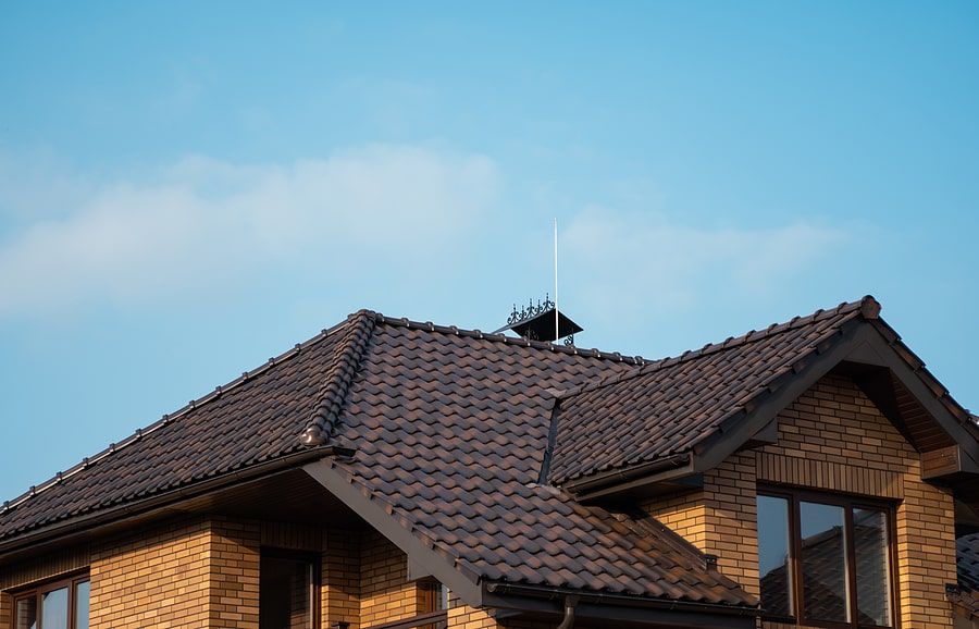 The roof of a house under blue sky