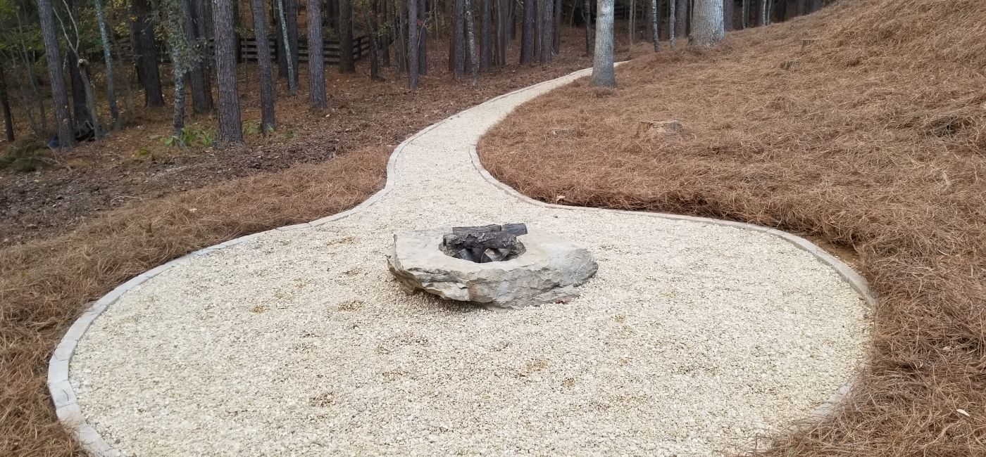 Bolder fire-pit and pea-gravel pathway