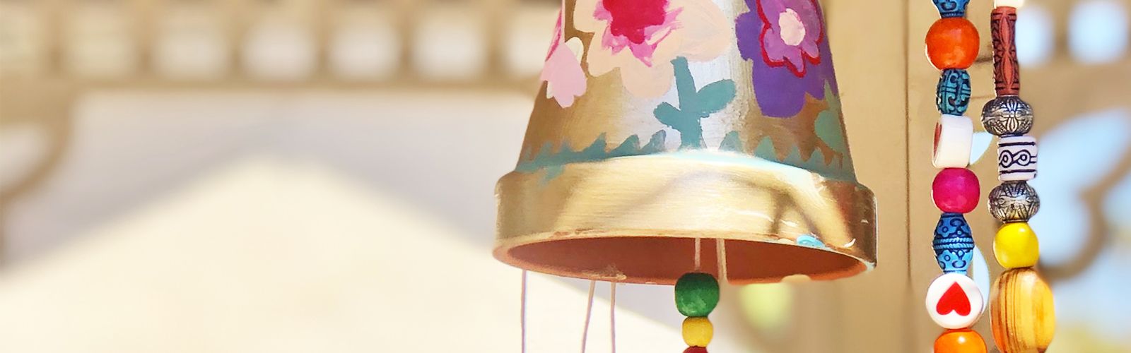 a close up of flower pot wind chime