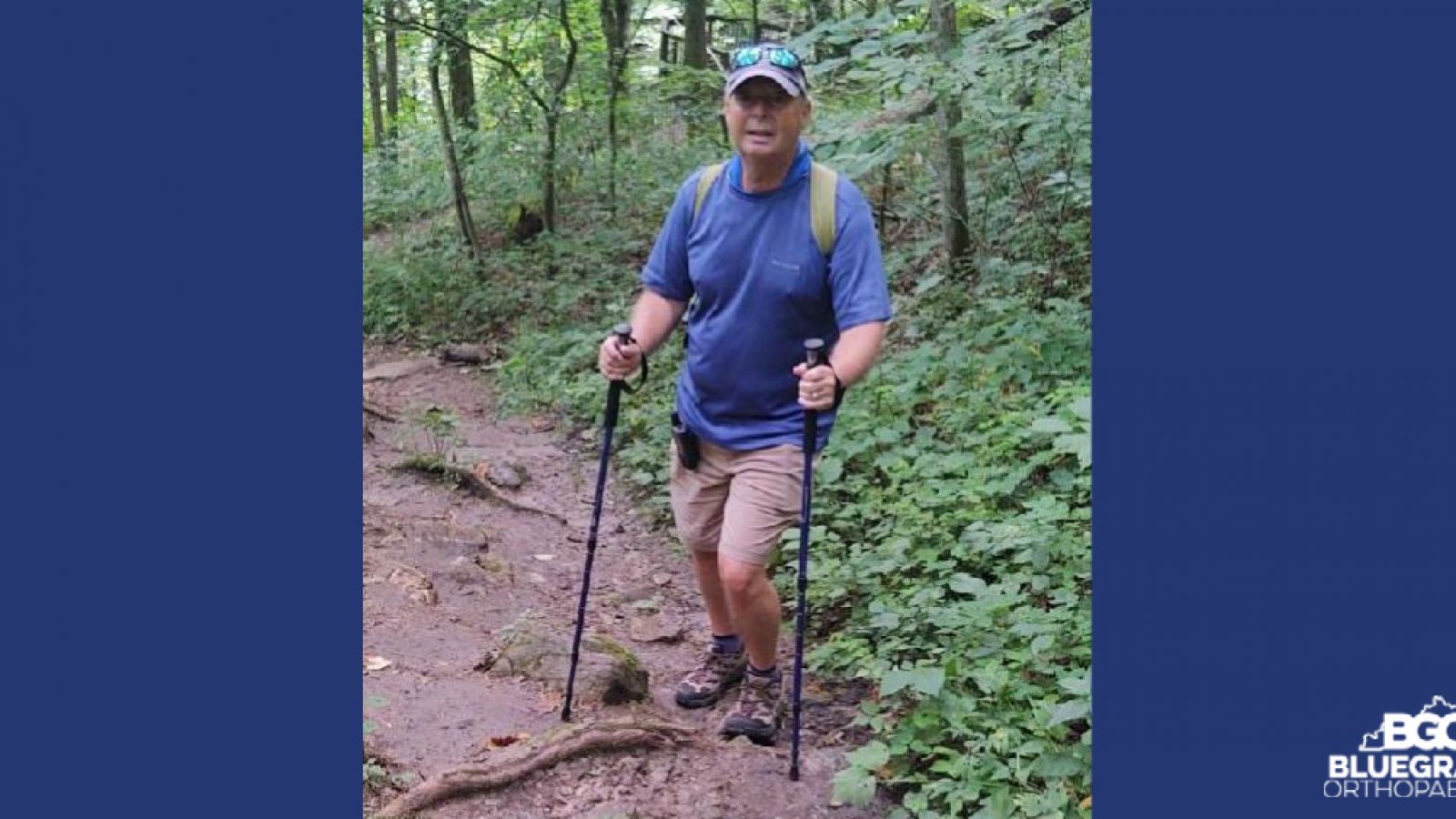 a man with a hiking stick