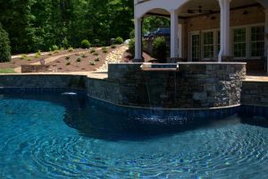 A gunite pool with an elevated, spillover spa.