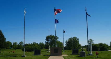 a cemetery with flags
