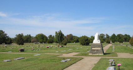 a cemetery with a statue
