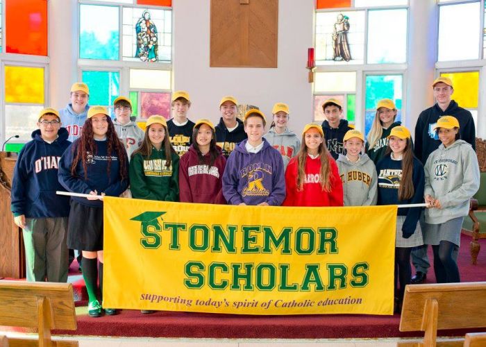 1st Annual StoneMor Scholars Award recipients holding a StoneMor Scholars banner